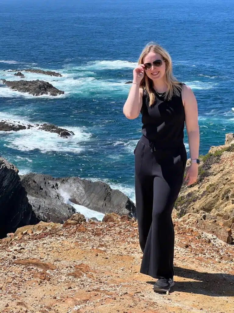 Jackie at the edge of a cliff on the Western coast of Portugal