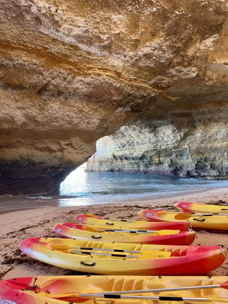 Kayaking at sunrise to the Benagil Caves in Algarve Portugal. This is truly the best of what the Algarve Coast has to offer!