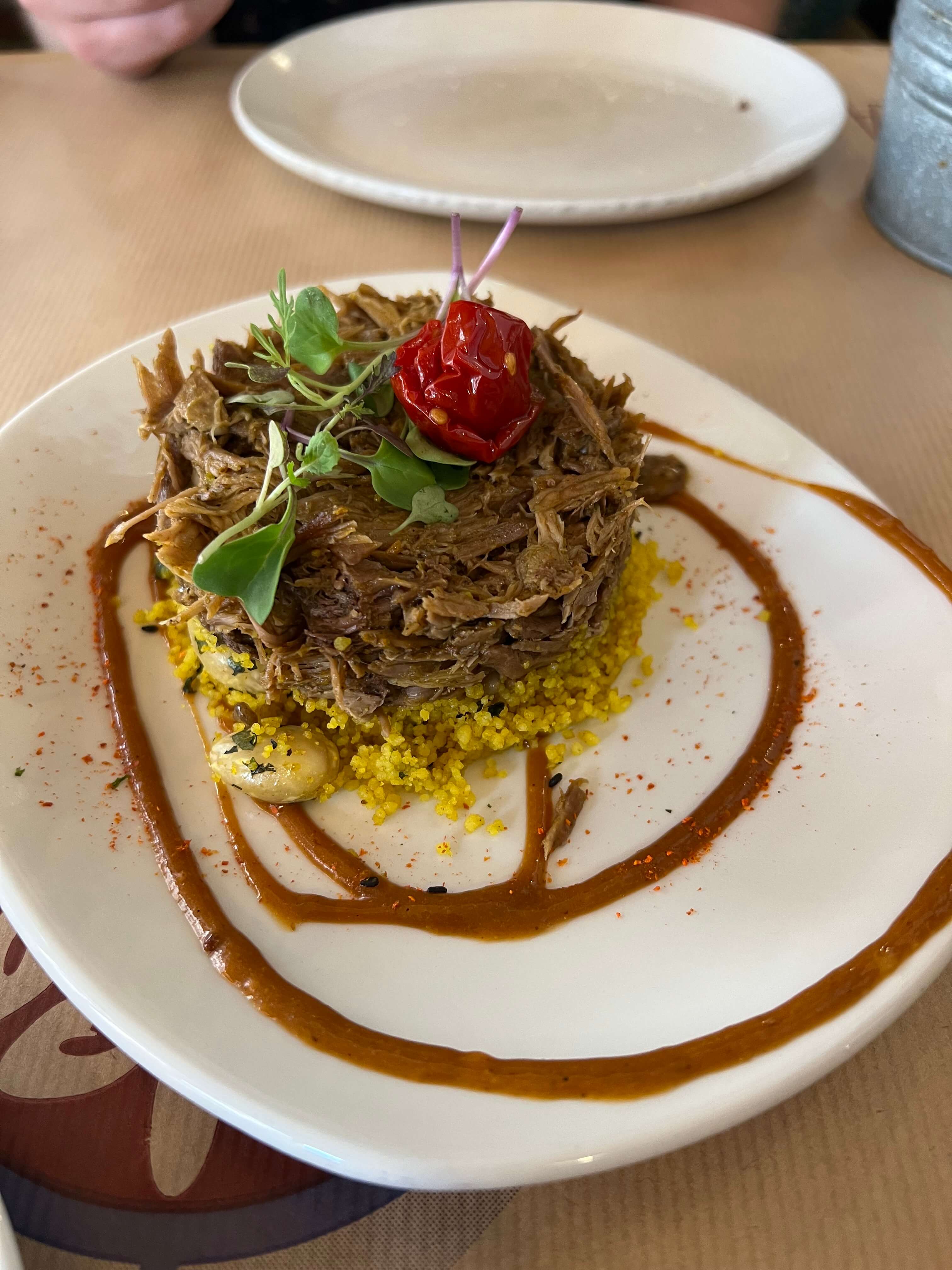 Lamb on cous cous at La Bartola, which was recommended by ChatGPT for our Algarve to Seville day trip