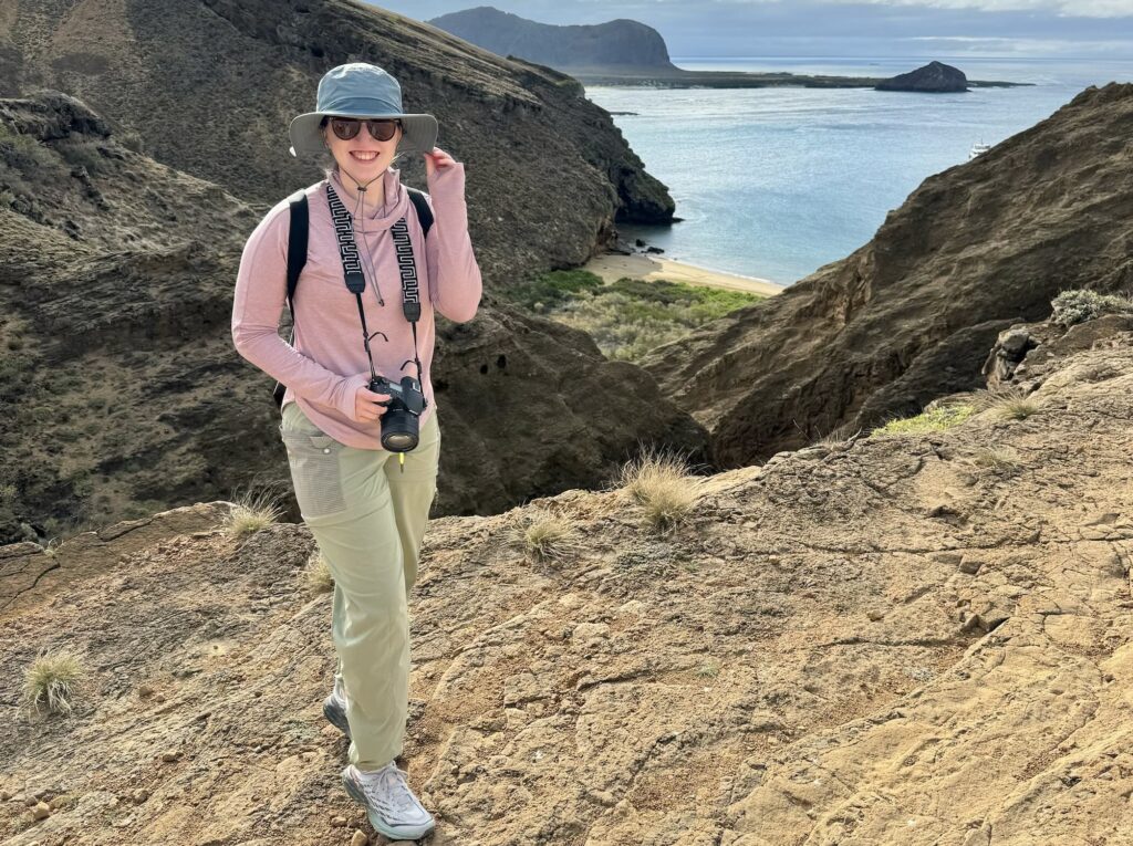 the author demonstrating an important tip for visiting the Galapagos - protecting yourself form the strong UV rays