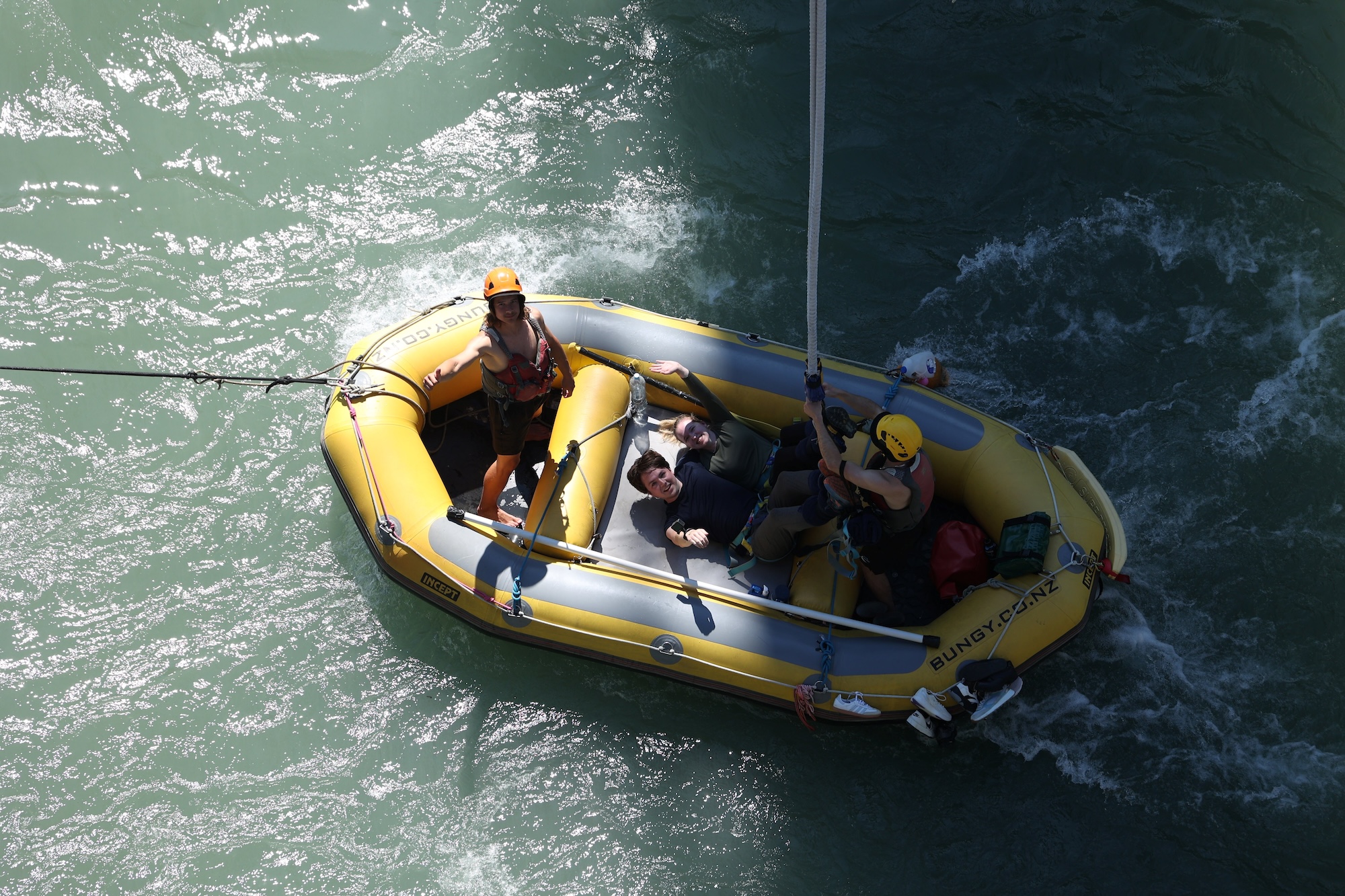 Being lowered into the raft after completing the Kawarau Bridge Bungee tandem