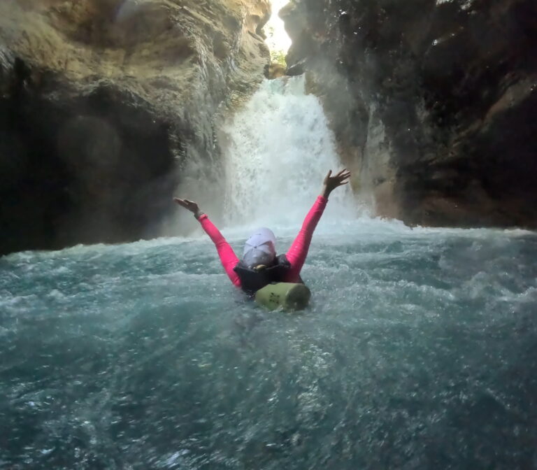 the author at the base of La Leona waterfall in Costa Rica