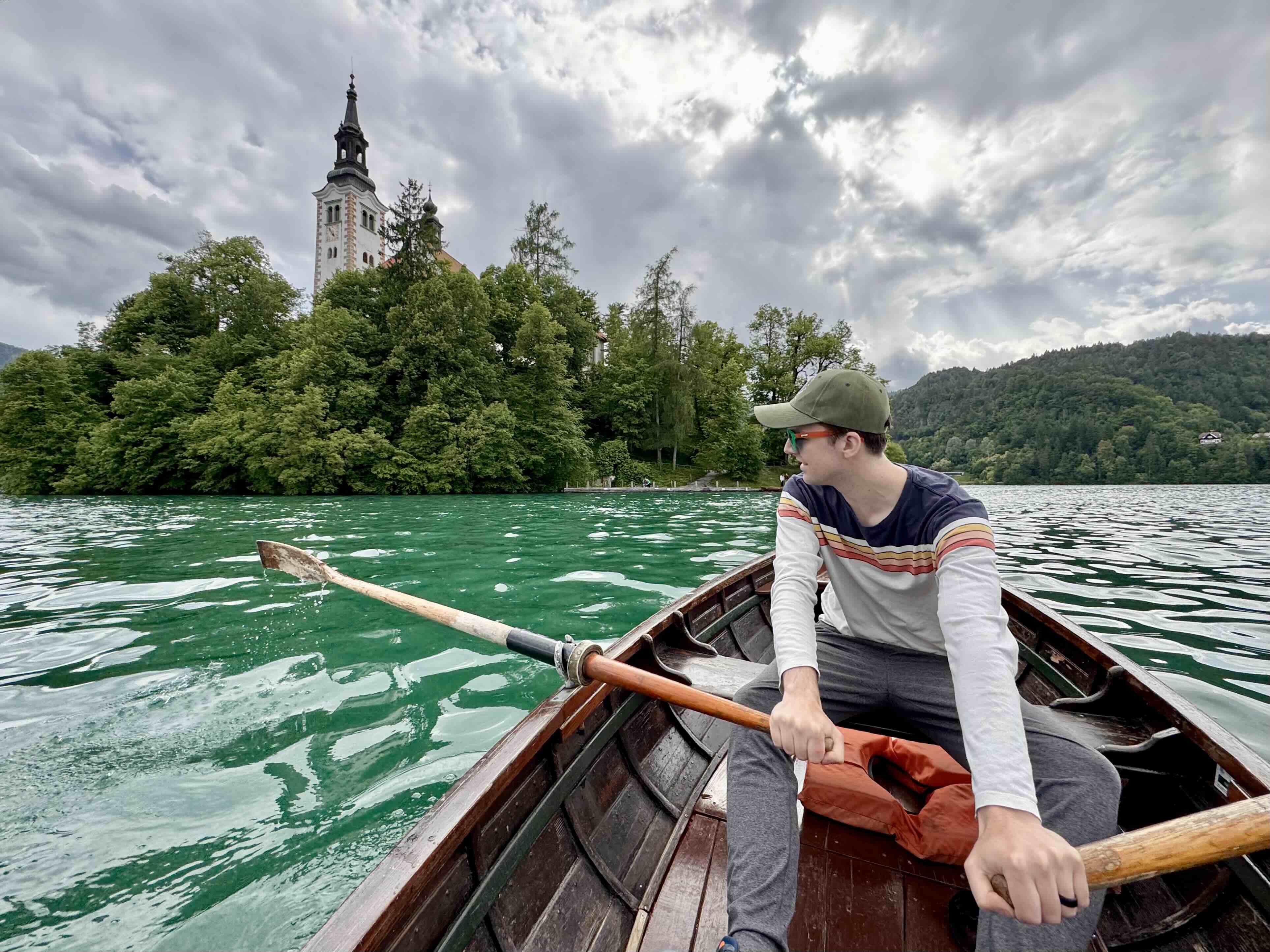 Rowing a wooden boat on Lake Bled in Slovenia